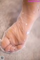 A close up of a person's foot with white stars on it.