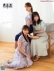 A group of young women sitting on the floor next to each other.